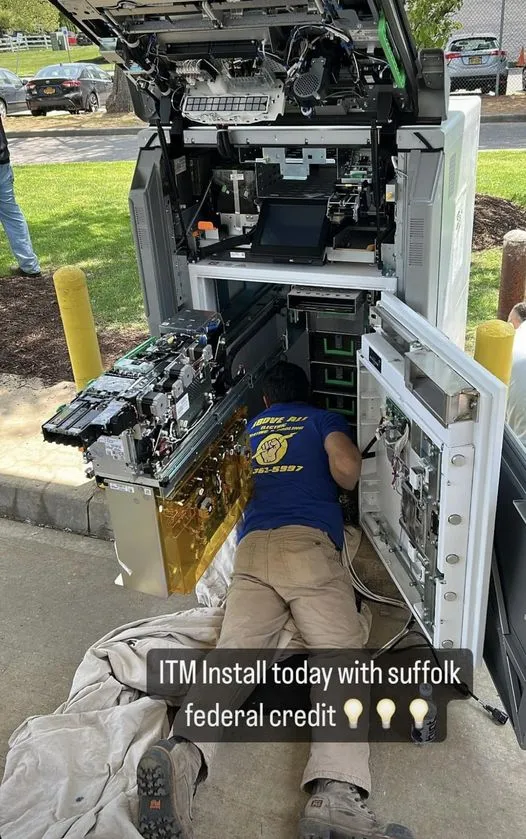 Professional at work on an electrical panel.